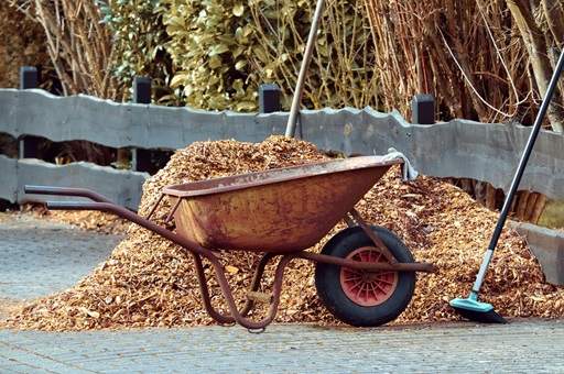 Mulch pile and wheelbarrow